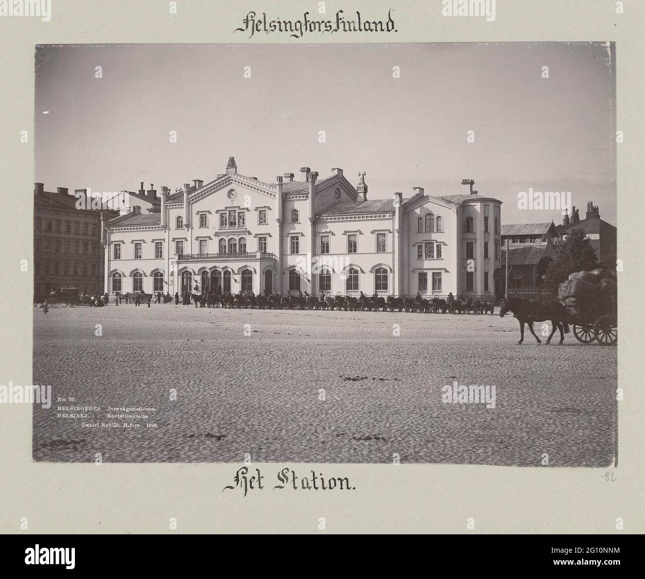 Old Train Station of Helsinki; No 70. Helsingfors JernVagsstaions Daniel Nyblin 1893.; Helsingfors Finland, the station .. The old train station in Helsinki, designed by Carl Albert Edelfelt and built in 1890. On Staions Square for the station there are a number of horses with carriages waiting for passengers. Stock Photo