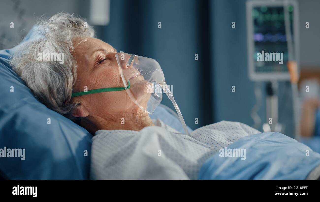 Hospital Ward Portrait of Beautiful Elderly Woman Wearing Oxygen Mask