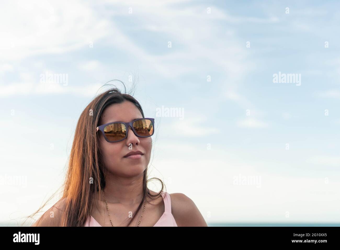 Fashion portrait of a very young woman wearing sunglasses Stock Photo ...