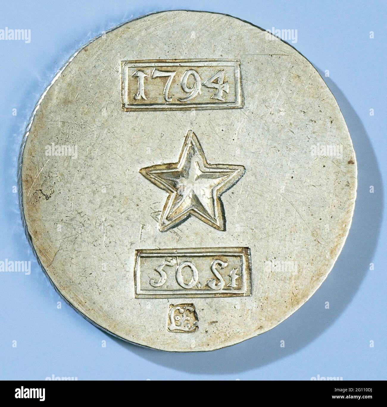 Emergency mints of Maastricht of fifty pennies. Emergency coin from fifty powers of the Maastricht siege through the French. Made from the silver of the St. Servaas and O.L. Vrouwe-Kapittels. Front: four stamps above each other; rectangular stamp with year; five-pointed star; Rectangular stamp with value indication and small stamp with monogrammed Letters L and E. Reverse: Blank. Stock Photo