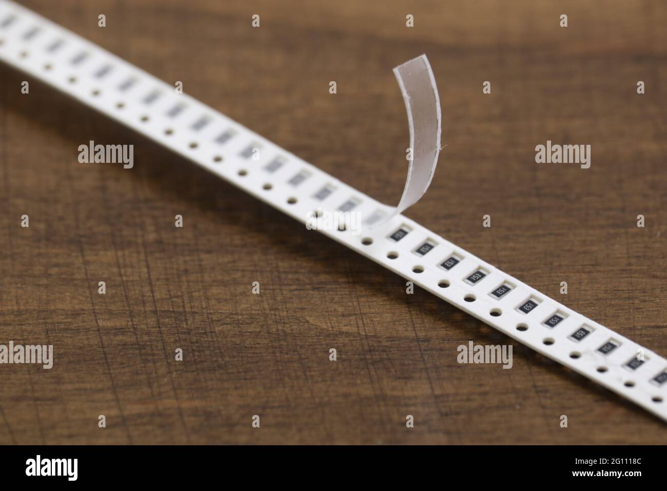 Electronic components: smd resistors on paper tape. Two-terminal passive components. Stock Photo