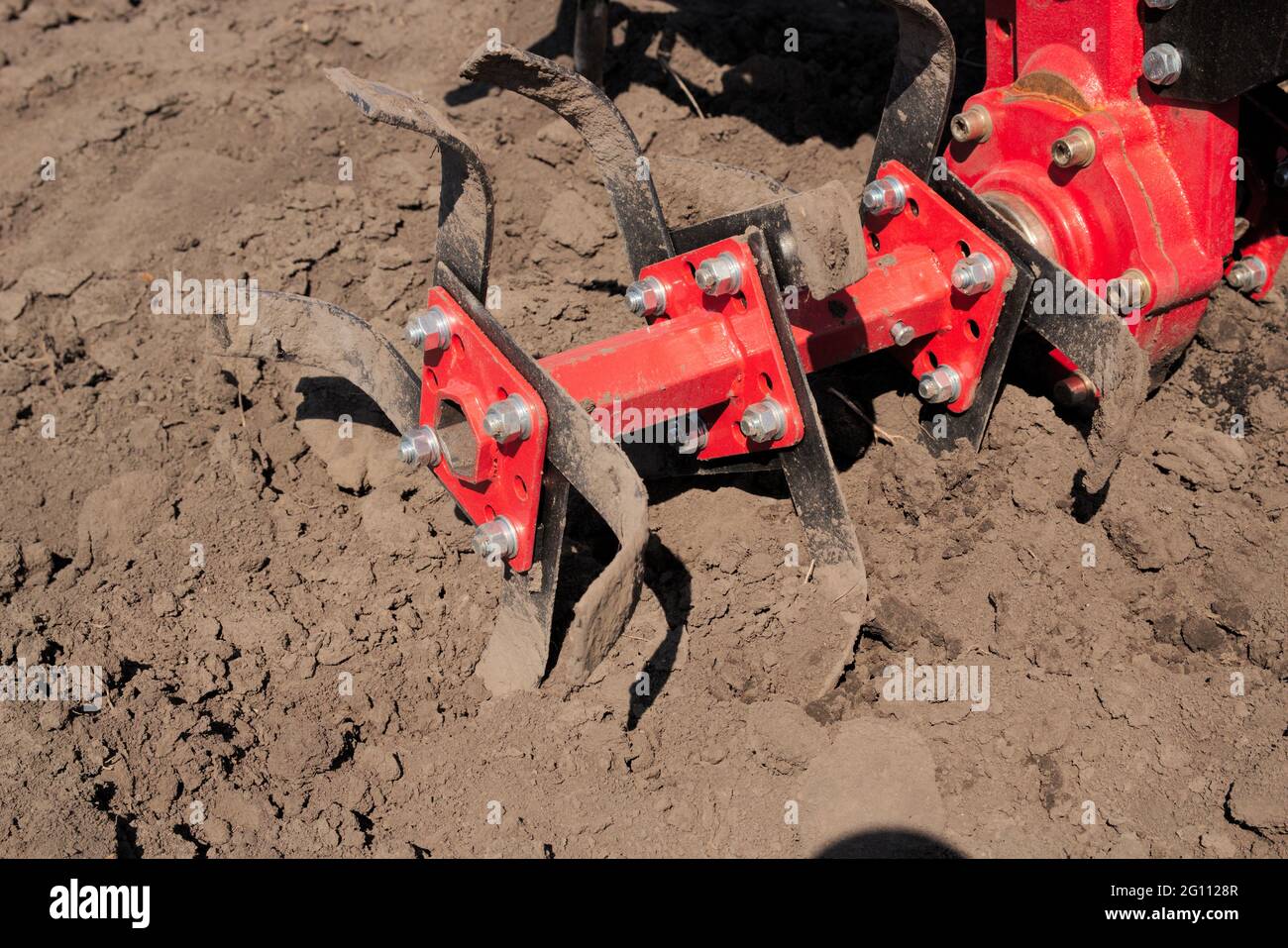 Garden tiller for cultivating field, loosens soil. Handheld motor plow Stock Photo Alamy