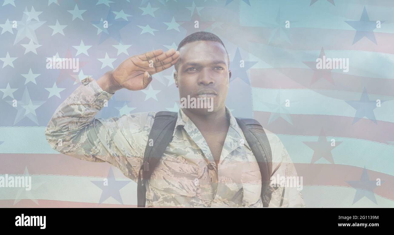 Composition of male soldier saluting over american flag Stock Photo - Alamy
