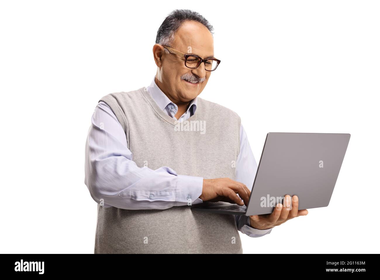 Casual mature man working on a laptop computer isolated on white background Stock Photo