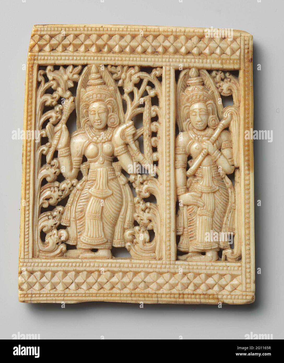 Fragment of a hair comb. Cut-away relief with a representation of two ...