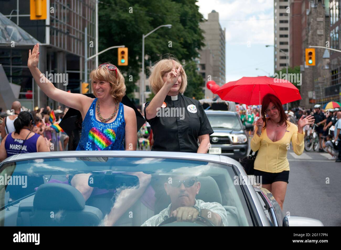 Cheri diNovo NDP MPP (wearing black)  and Laurel Broten ( wearing blue and rainbow) Pride Marshalls in Toronto Pride: Women riding in the car cabriole Stock Photo