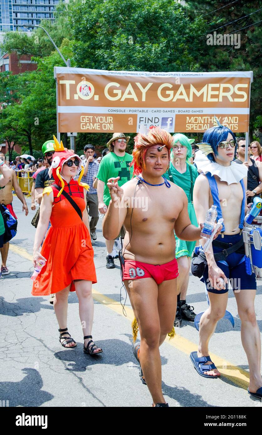 Toronto Pride Parade Scenes: Marchers at a gay pride parade dressed as characters from Nintendo's PokÈmon series with other games in the background un Stock Photo