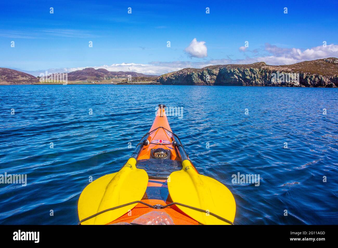 Sea kayaking in the Summer Isles in the North West Highlands of Scotland Stock Photo