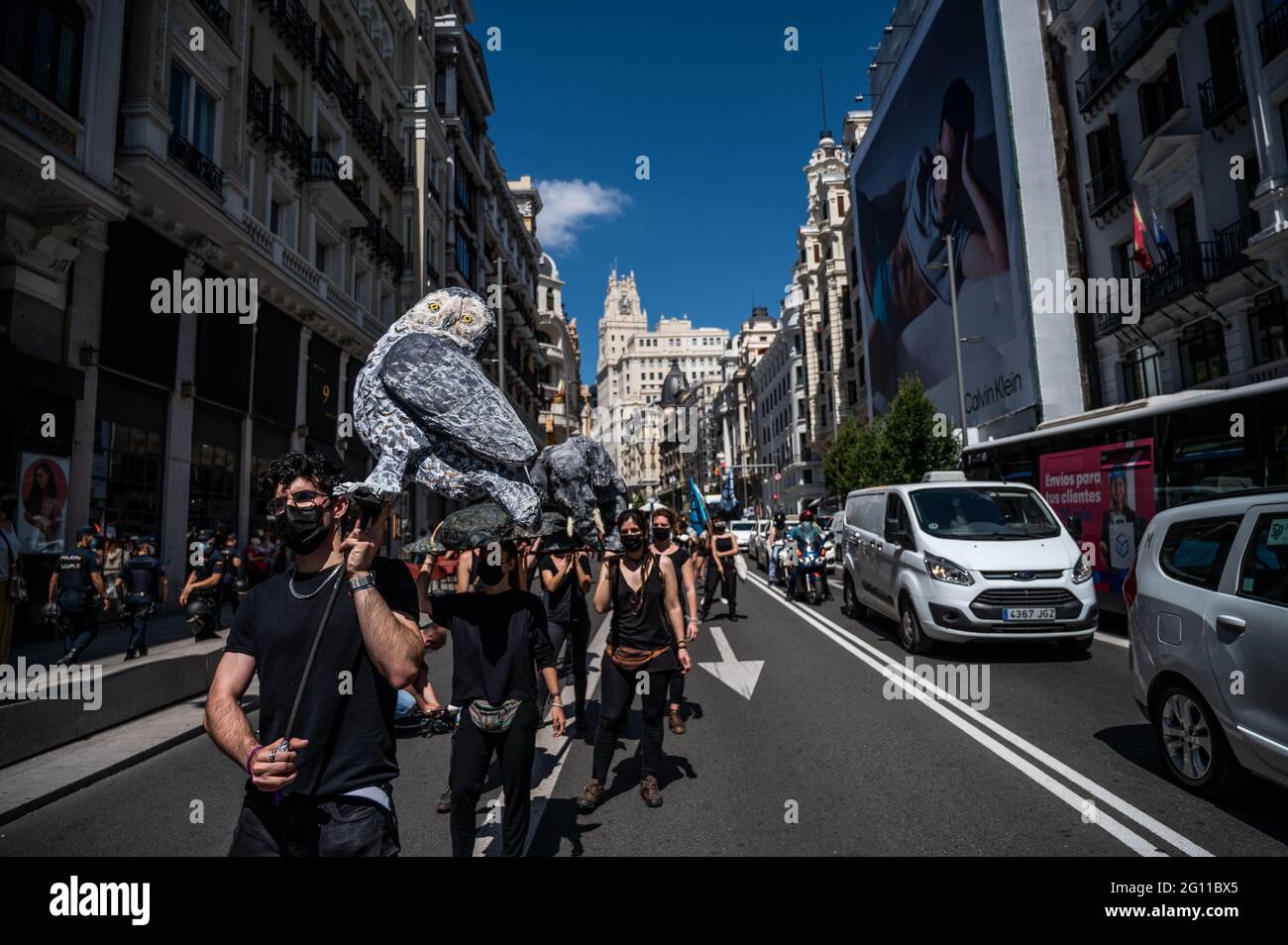 Madrid, Spain. 04th June, 2021. Climate change activists of Extinction Rebellion group marching with animal sculptures through Gran Via Street blocking traffic demanding that ecocide (destruction of ecosystems and the irreversible damage of the environment) to become an international crime. Credit: Marcos del Mazo/Alamy Live News Stock Photo