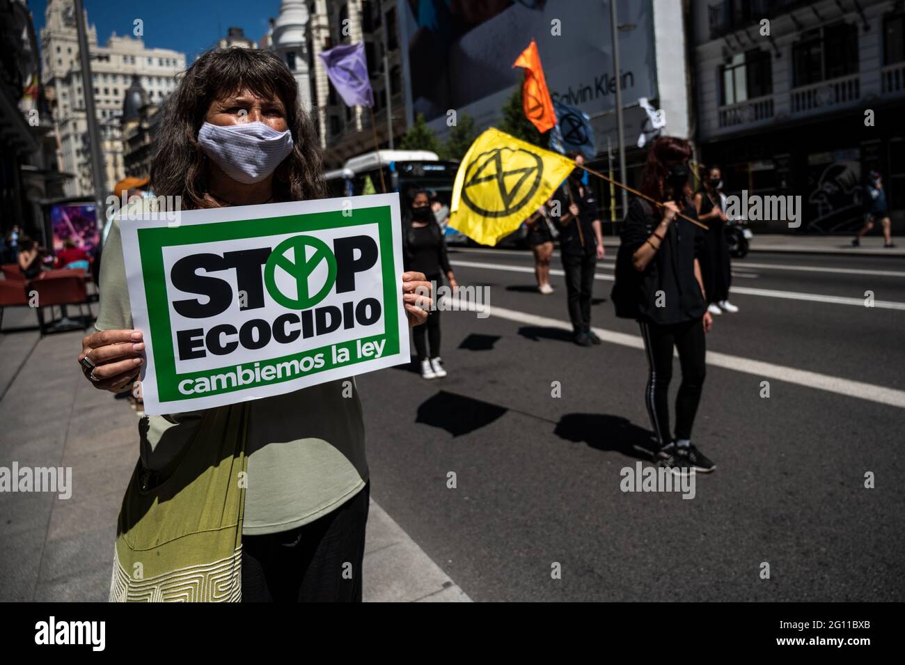 Madrid, Spain. 04th June, 2021. Climate change activists of Extinction Rebellion group marching through Gran Via Street blocking traffic demanding that ecocide (destruction of ecosystems and the irreversible damage of the environment) to become an international crime. Credit: Marcos del Mazo/Alamy Live News Stock Photo