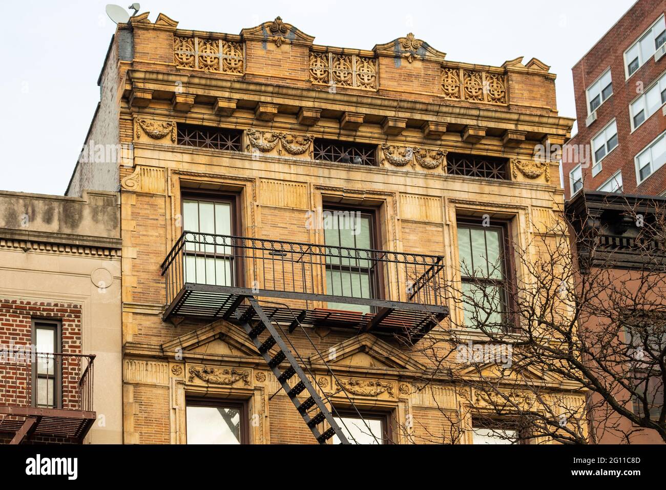 Fire escape stairs down the outside of a building in Brooklyn, New York Stock Photo