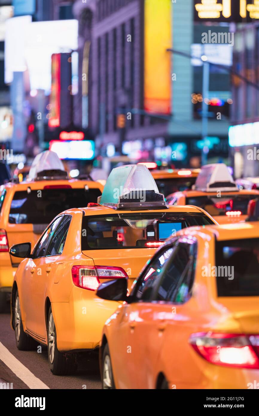 USA, NY, New York City, Row of yellow cabs in Times Square Stock Photo