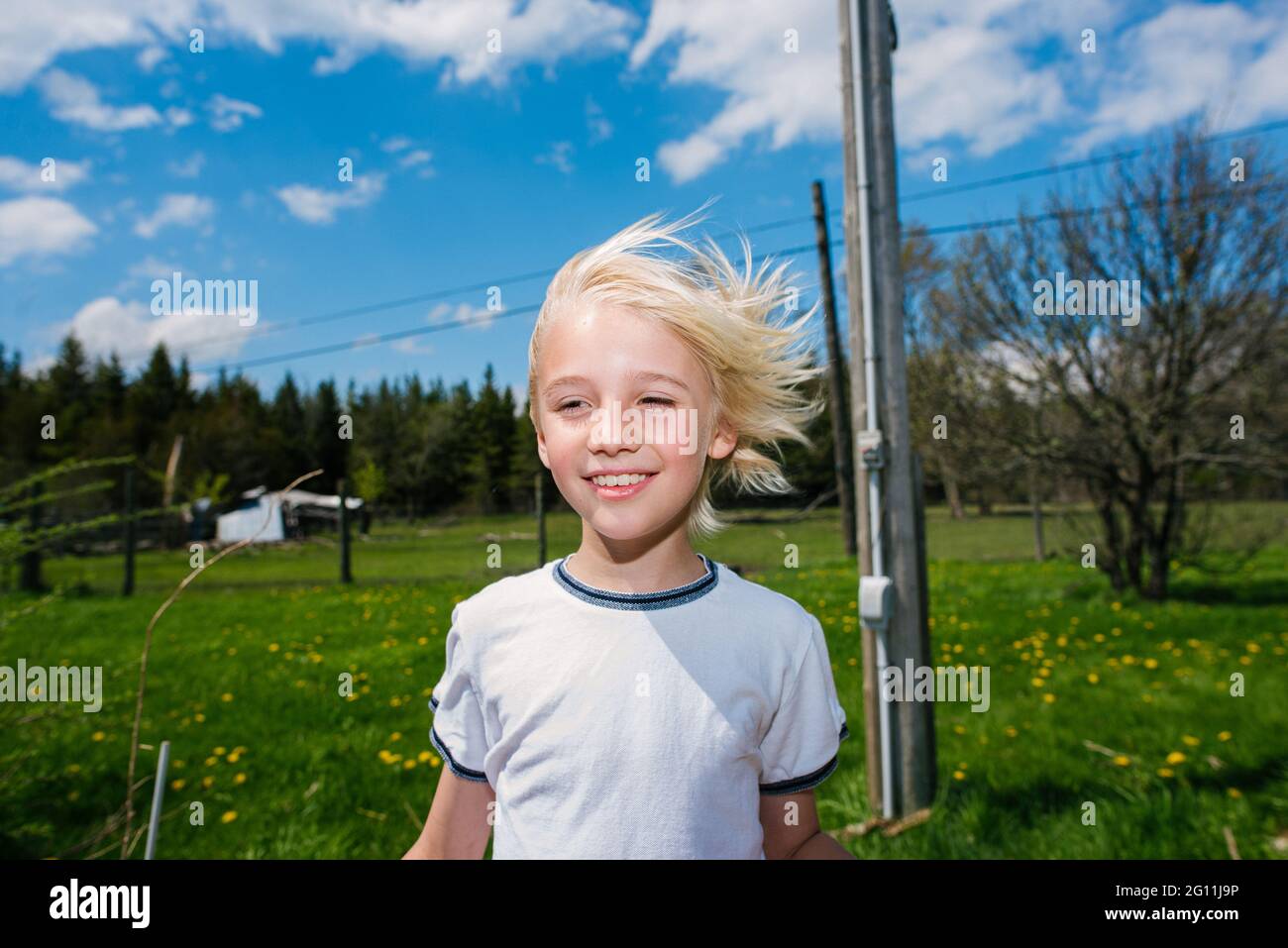 Canada, Ontario, Kingston, Portrait of boy in field Stock Photo