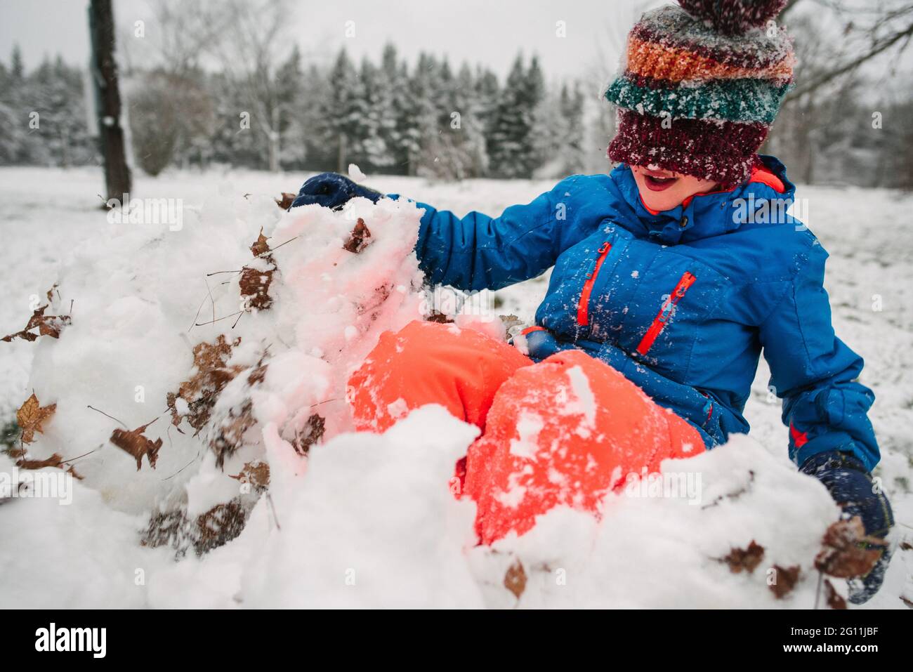 Canada, Ontario, Boy playing in snow Stock Photo