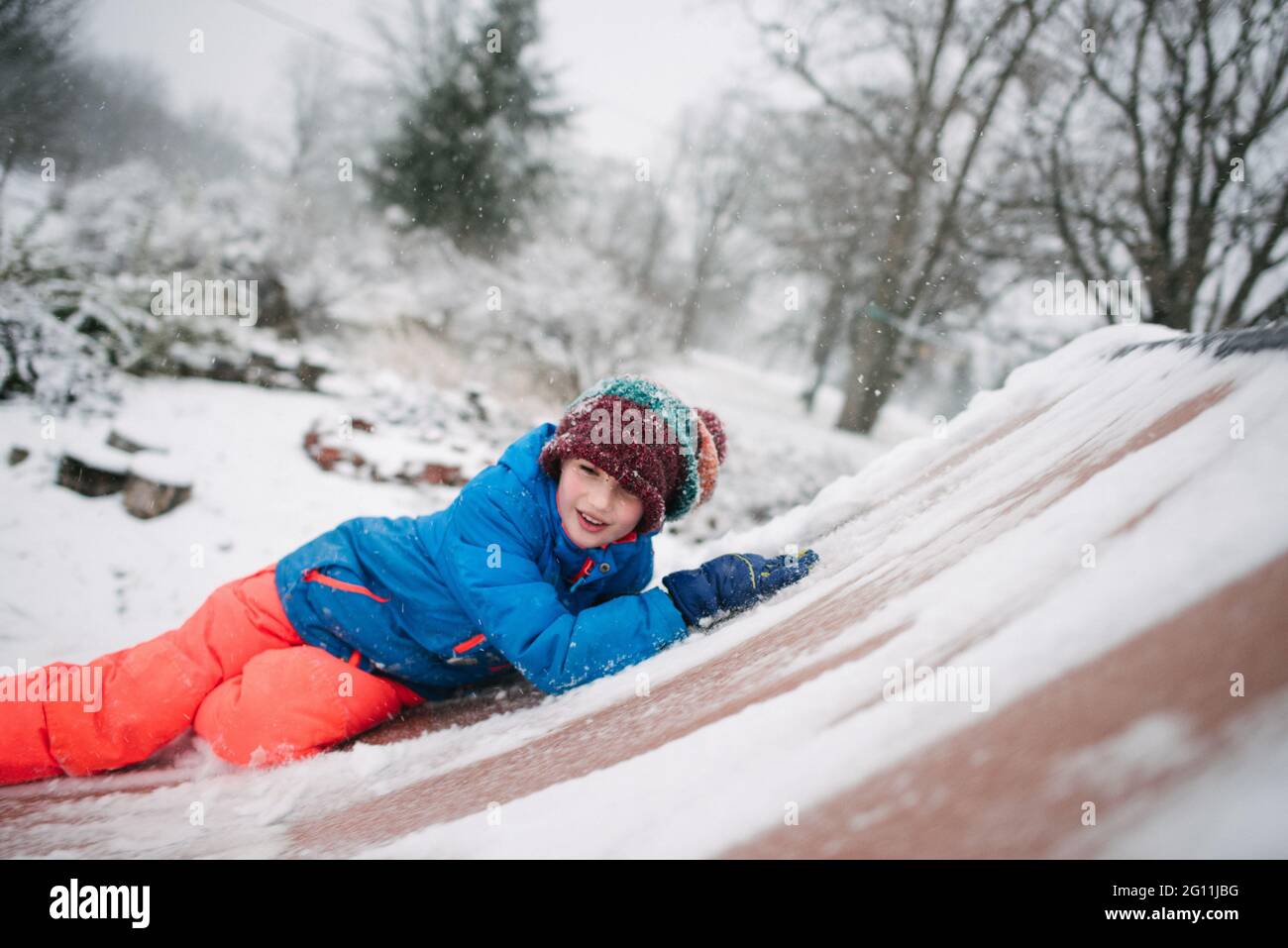 Canada, Ontario, Boy playing in snow Stock Photo