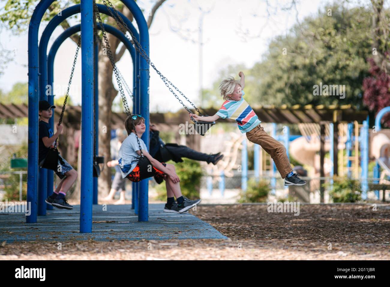 USA, California, San Francisco, Children on swings at playground Stock