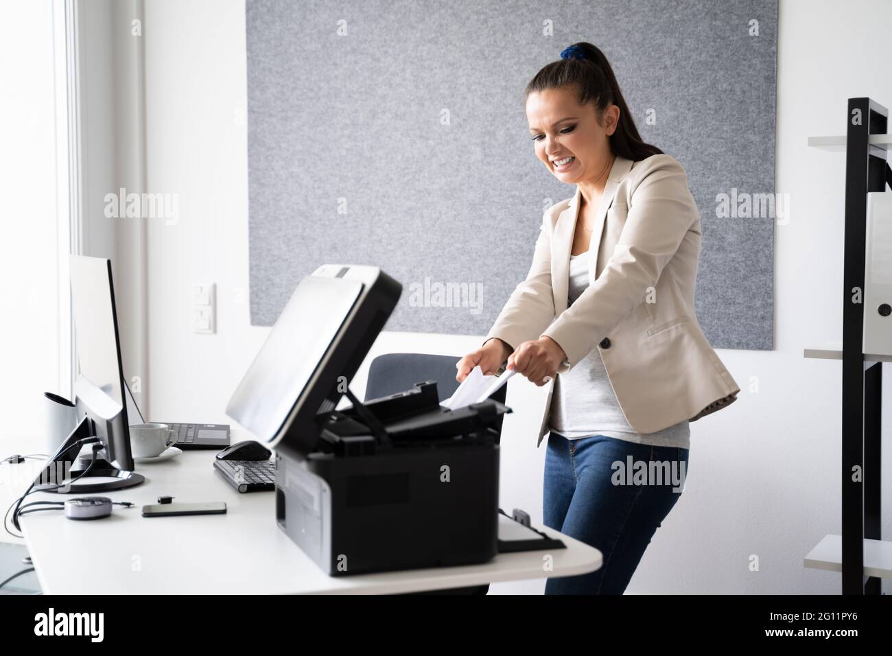Broken Office Printer. Annoyed By Paper Jam Stock Photo