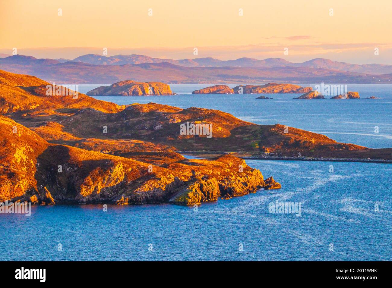 The Summer Isles in evening light . The archipelago lies of the coast of North West Scotland Stock Photo