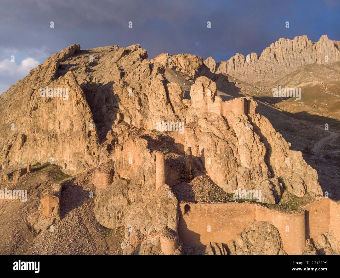 Fantastic Dramatic Aerial view of the ruins of the Dogubayazit castle, built on the mountain near Eski Bayezid Cami and the Ishak Pasha Palace Stock Photo