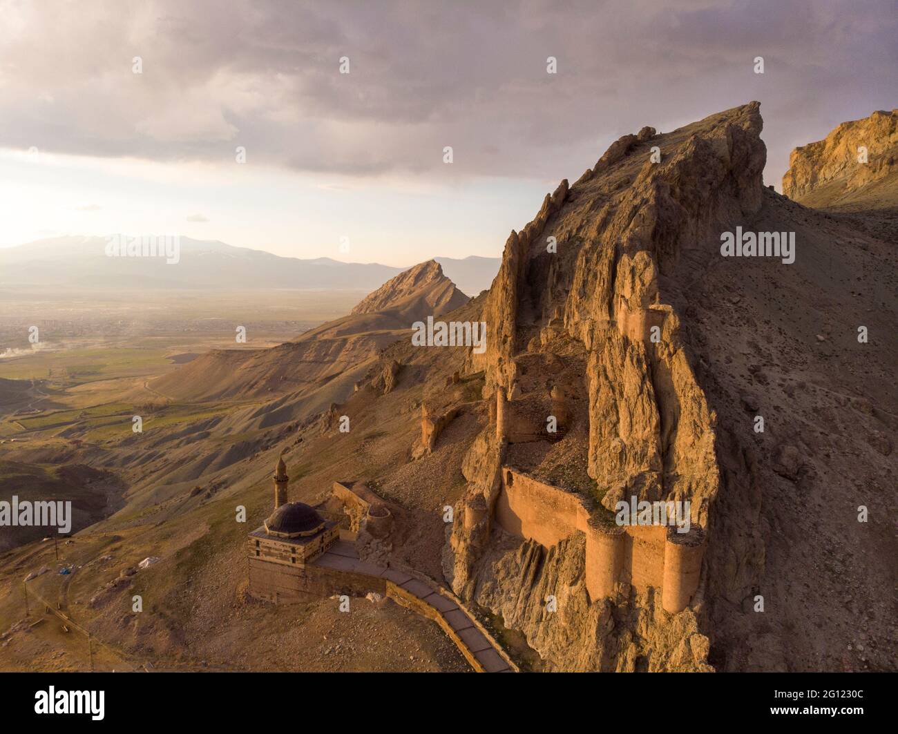 Fantastic Dramatic Aerial view of the ruins of the Dogubayazit castle, built on the mountain near Eski Bayezid Cami and the Ishak Pasha Palace Stock Photo