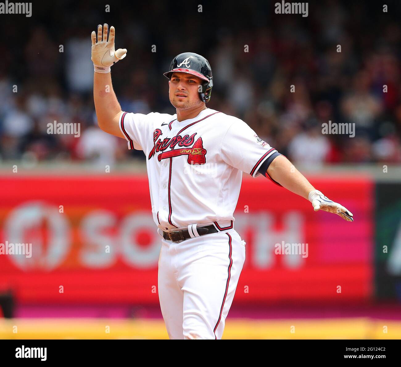 Atlanta Braves third baseman Austin Riley reacts with a chop after