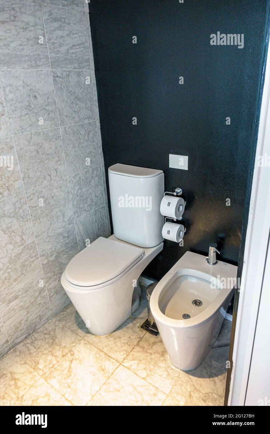 Argentina Buenos Aires San Telmo Curio Collection by Hilton hotel guest room bathroom fixtures toilet bidet modern Stock Photo