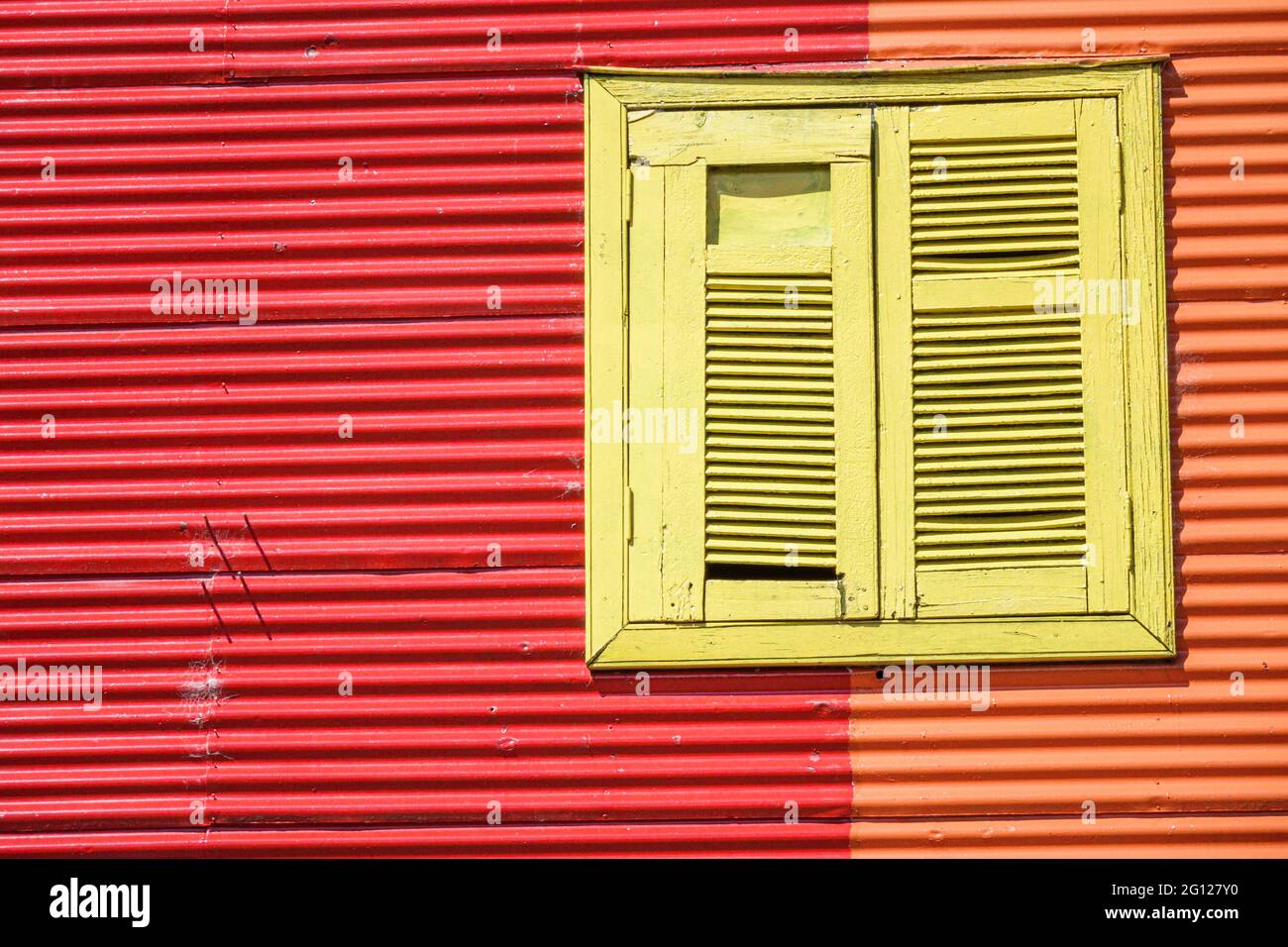 Argentina Buenos Aires Caminito Barrio de la Boca iconic neighborhood cultural landmark painted buildings Conventillo urban housing window shutters br Stock Photo