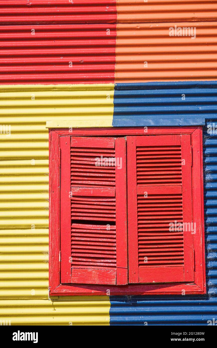 Argentina Buenos Aires Caminito Barrio de la Boca iconic neighborhood cultural landmark painted buildings Conventillo urban housing window shutters br Stock Photo