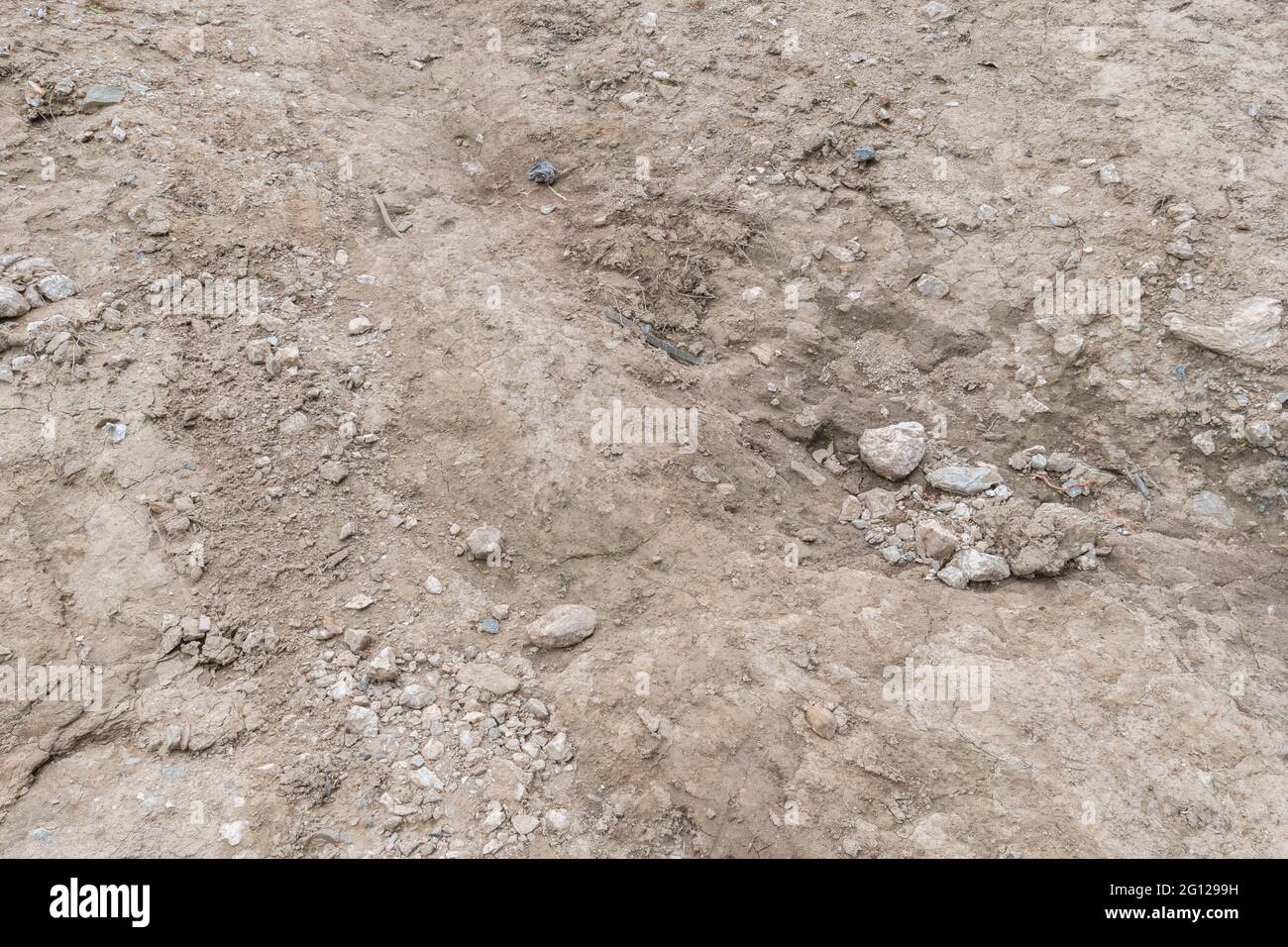 Dry rough field with many stones in soil. For poor farmland, stony