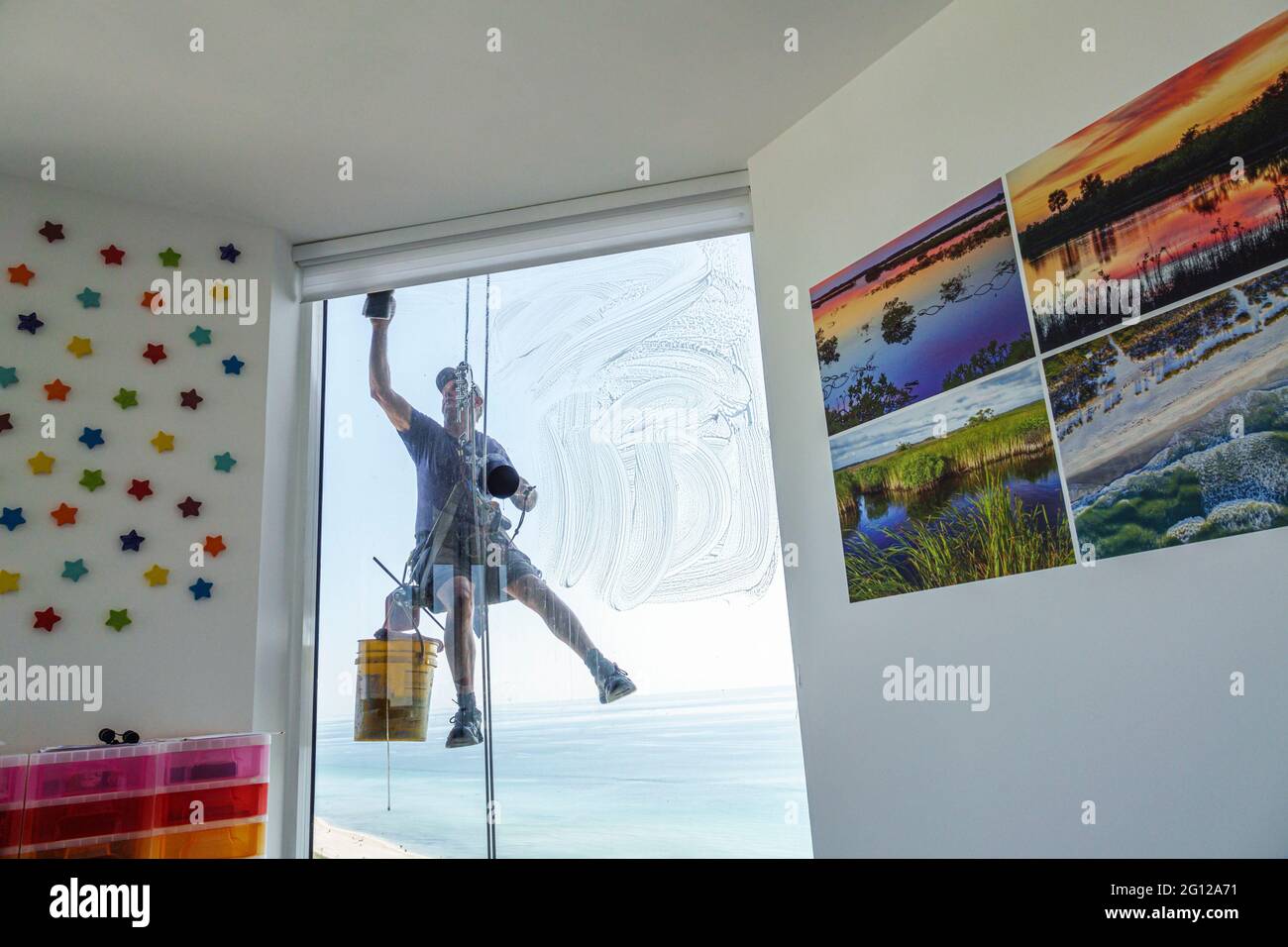 Florida FL Miami Beach high rise condominium man glass window washer