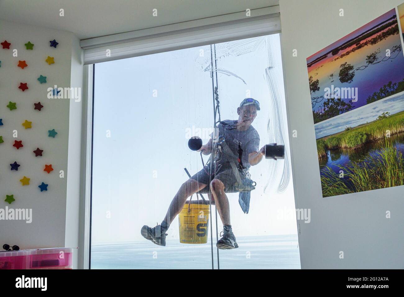 Florida FL Miami Beach high rise condominium man glass window washer