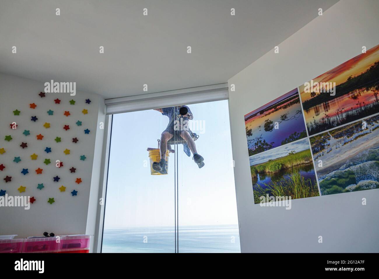 Florida FL Miami Beach high rise condominium man glass window washer