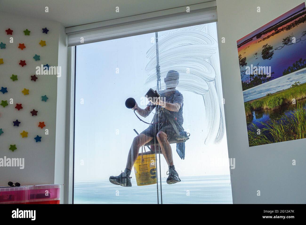 Florida FL Miami Beach high rise condominium man glass window washer