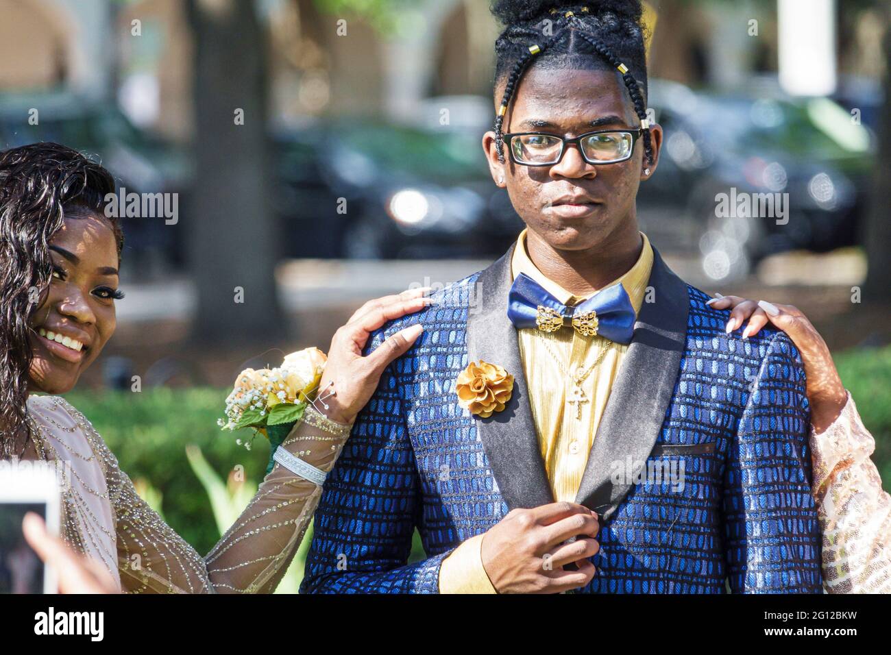 Florida Orlando Lake Eola Park high school prom milestone event coming of age photo shoot fashion fashionable formal wear tuxedo dress-up milestone ev Stock Photo