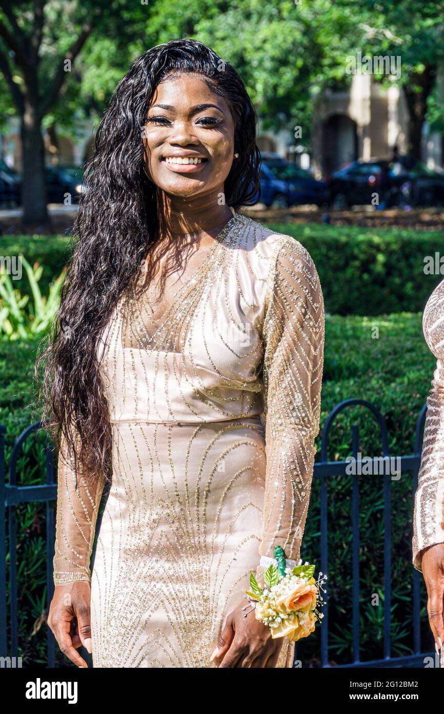 Florida Orlando Lake Eola Park high school prom photo shoot fashion fashionable formal wear gown dress-up milestone event Black girl teen student Stock Photo