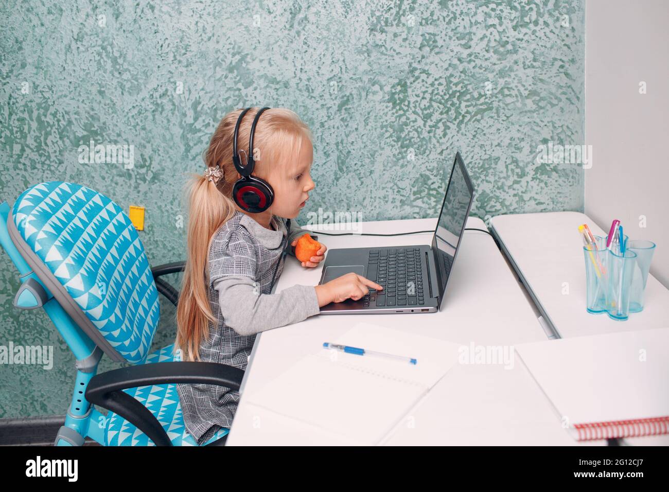 little girl with laptop learning and preparing back to school Stock ...