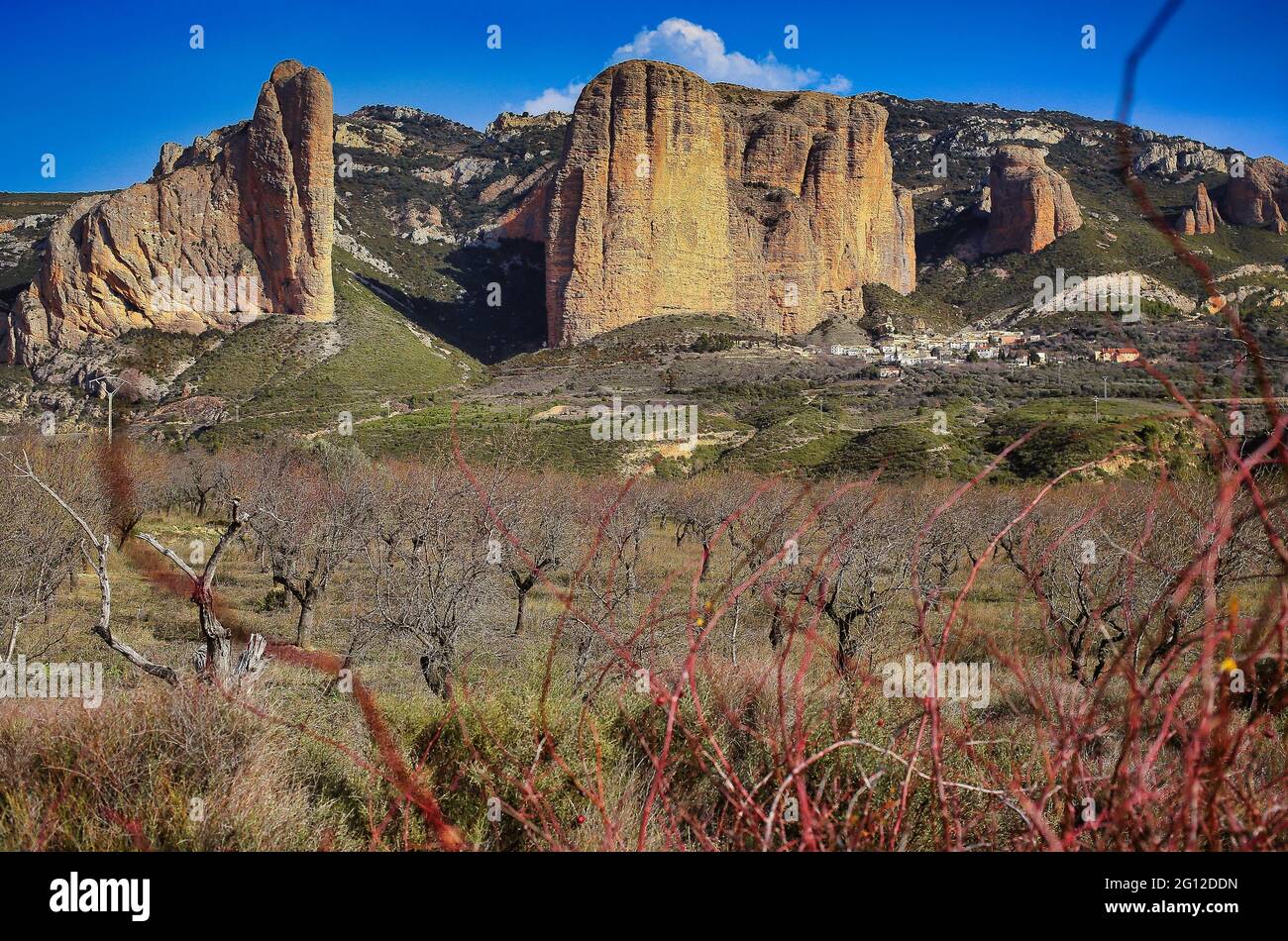 The Riglos mallos are geological formations consisting of vertical-walled rocks, called mallos, located in the Spanish town of Riglos, in the Stock Photo