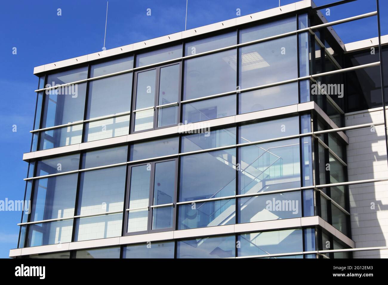 Building with large and modern glass facade. Stock Photo