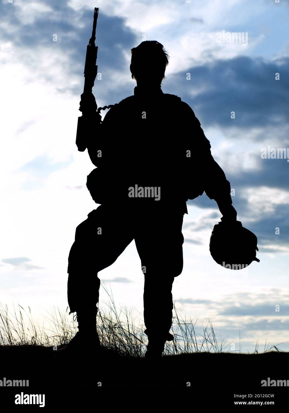 Silhouette of US soldier with rifle against a sunset Stock Photo Alamy