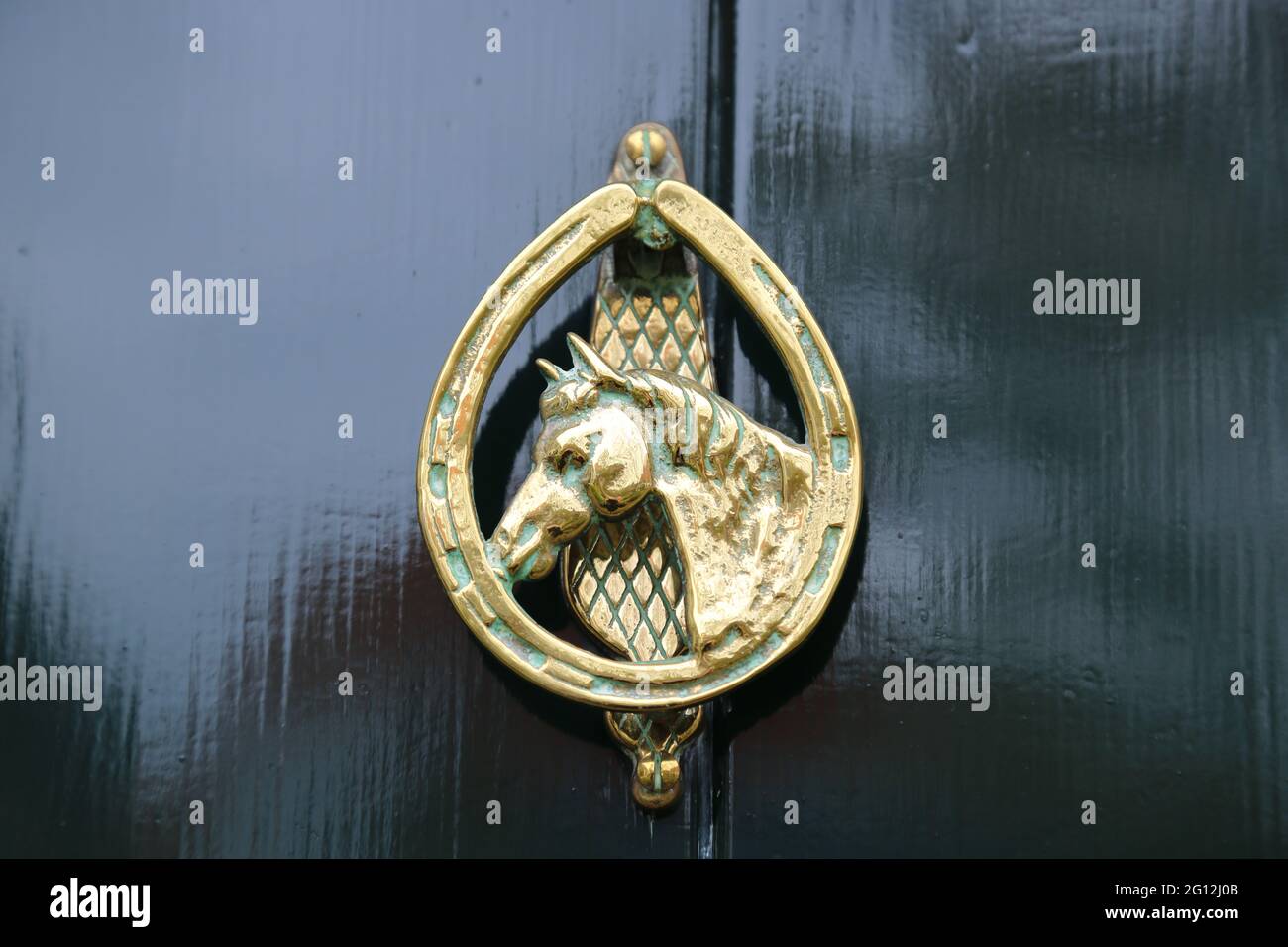 An antique brass door knocker Stock Photo - Alamy