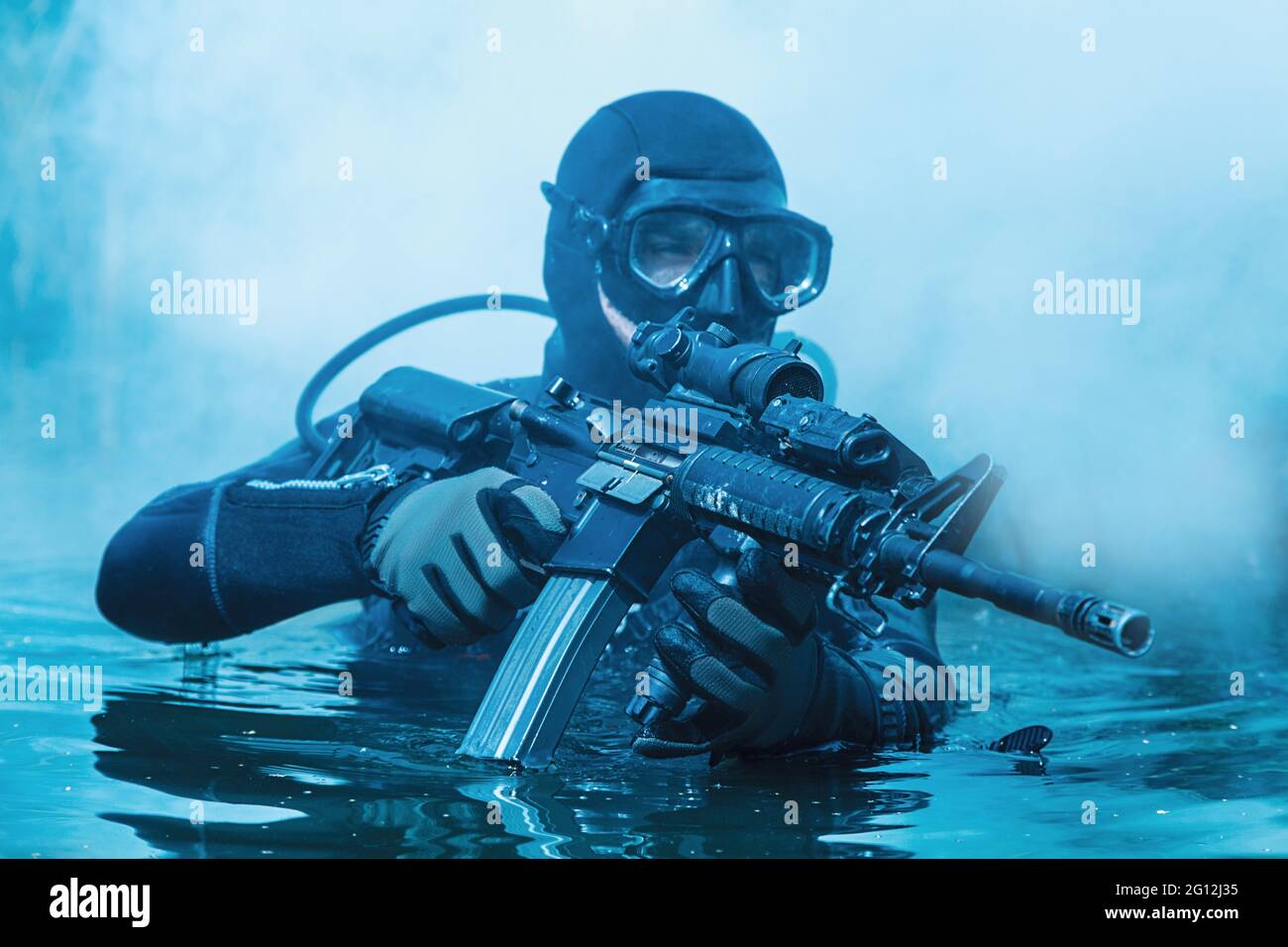 Frogman with complete diving gear and weapons in the water. Stock Photo