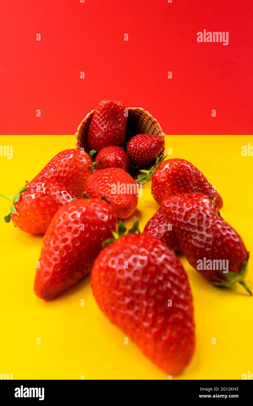 Ice cream cone with strawberries. Strawberry icecream. Healthy summer food concept. Stock Photo