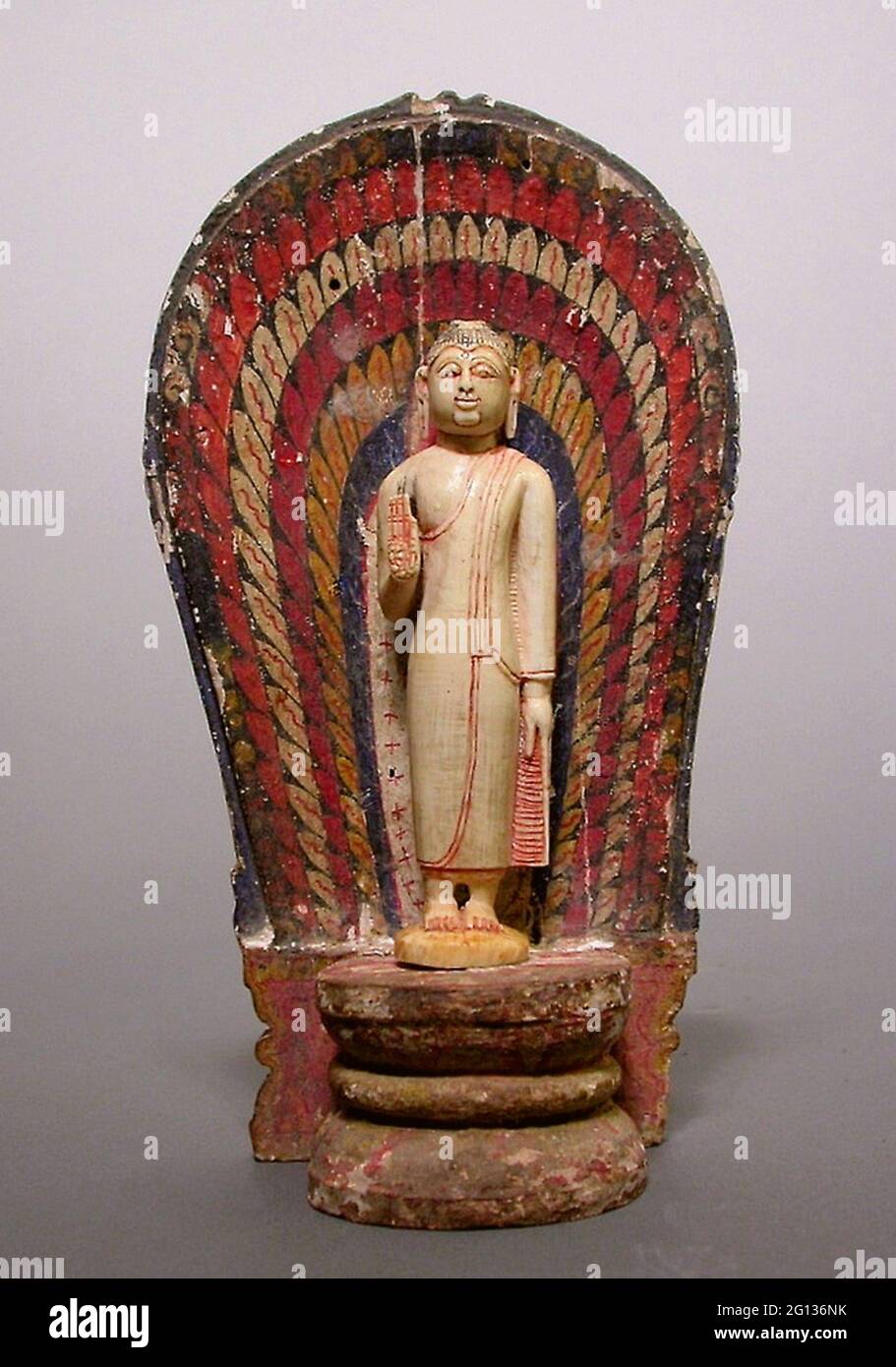 Buddha Standing with Hand in the Gesture of Reassurance (Abhayamudra) with Radiating Nimbus - Kandyan period (1480 - 1815) - Sri Lanka. Ivory, wood, Stock Photo