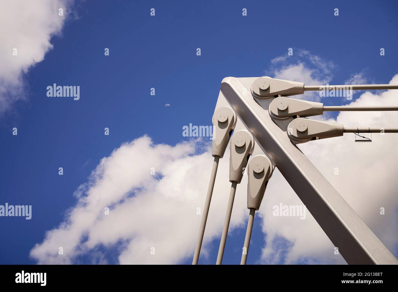 Detail of built structure over blue sky with white clouds. Stock Photo