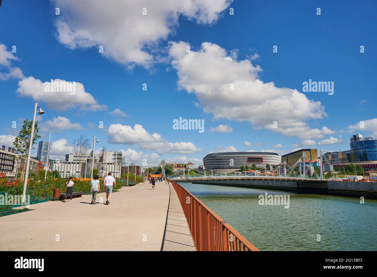 Nervion river and Frank Gehry bridge with the Athletic club de Bilbao Football Stadium (San Mames), Bilbao, Biscay, Euskadi, Euskal Herria, Basque Stock Photo