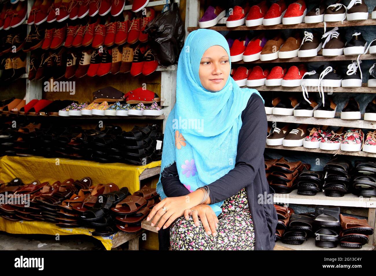 Malay girl selling shoe, Local market, Hawker stalls at Serikin