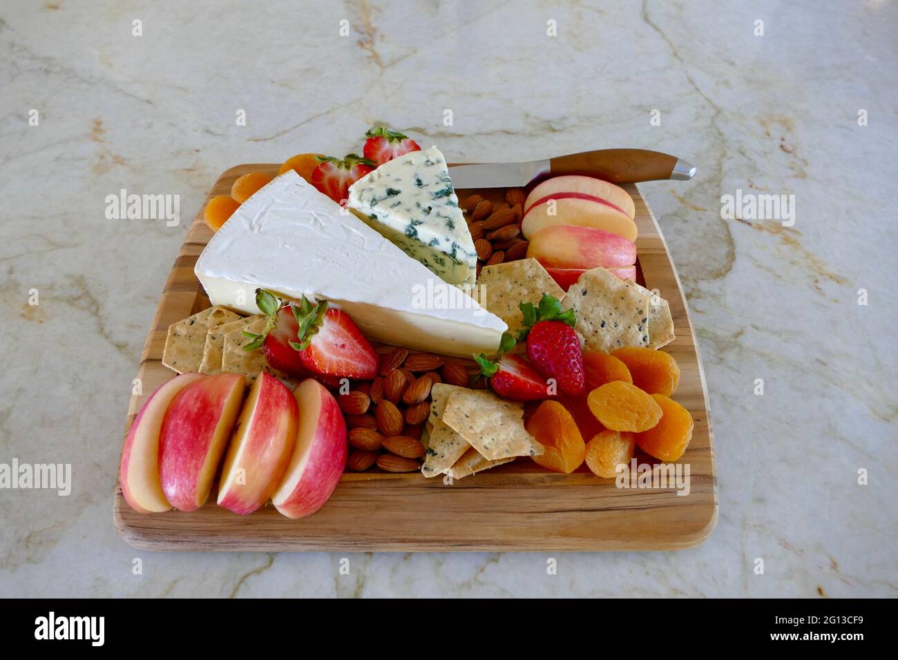 cheese board with fresh fruit and nuts Stock Photo Alamy