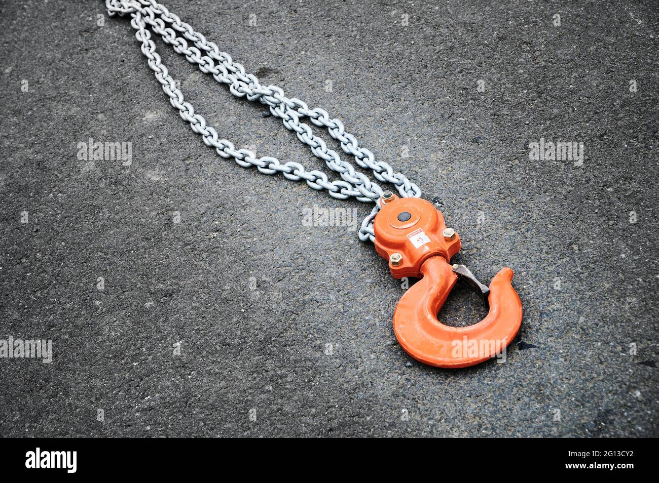 Orange Steel hook and chain. Stock Photo