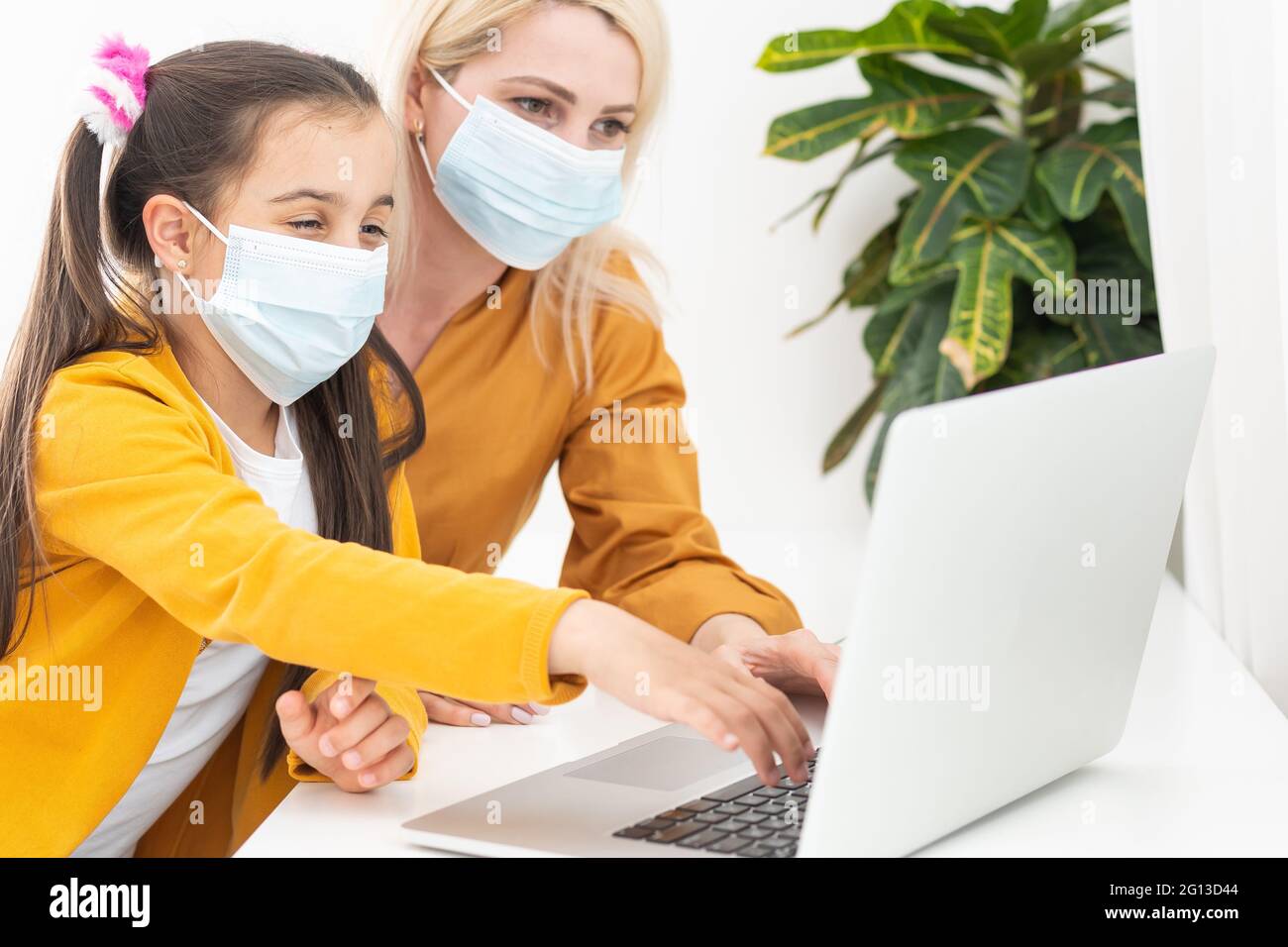 Online remote learning. School kids with computer having video ...