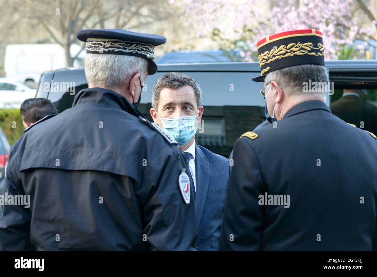 Gerald Darmanin (front center) talks with two police officers before  leaving a police station.Gerald Darmanin, Minister of Interior in Emmanuel  Macron's government, visits police stations every month to announce or  present the